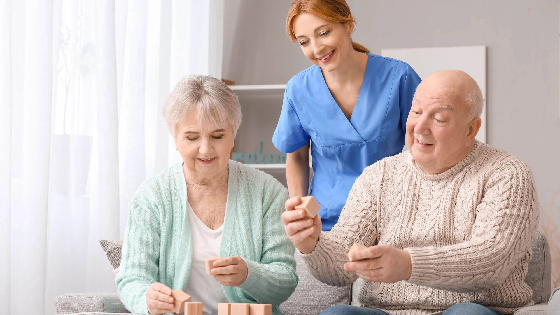 A caregiver enjoying a tabletop activity with clients at home