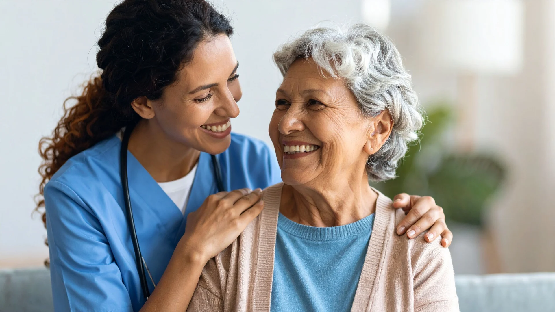 A caregiver sharing a warm moment with an older client